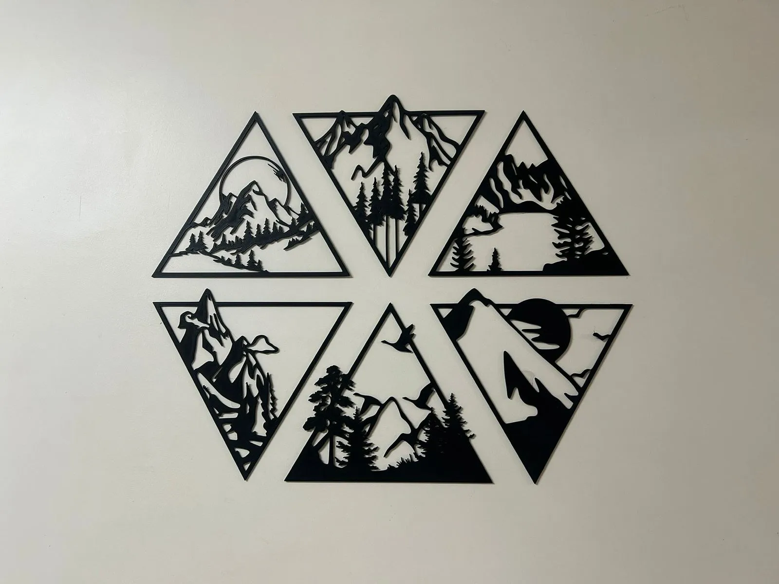 Mountain hexagon wall art, six matte black triangular panels arranged into a hexagon